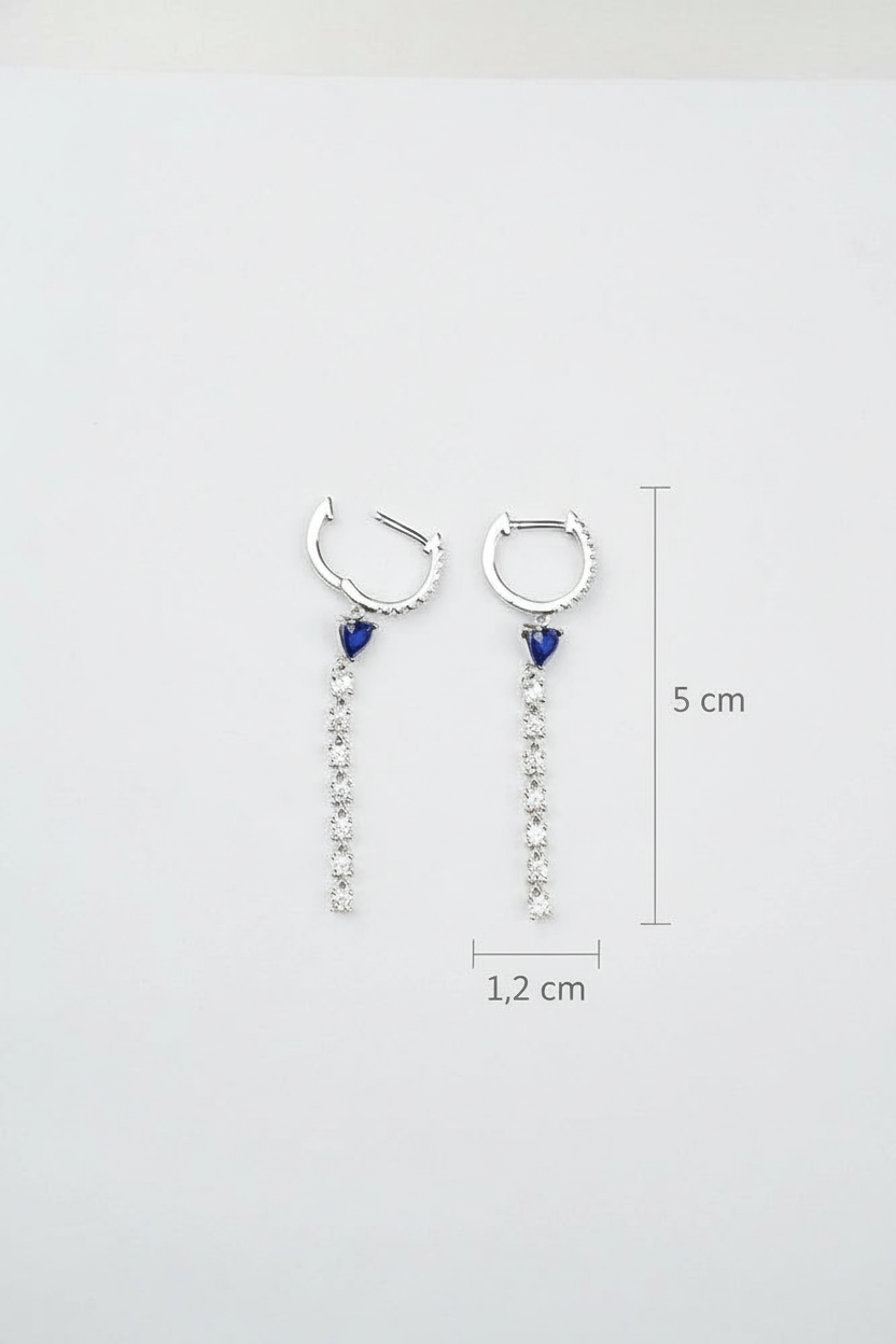 Pair of silver hoop earrings with blue gemstones and measurements on a white background