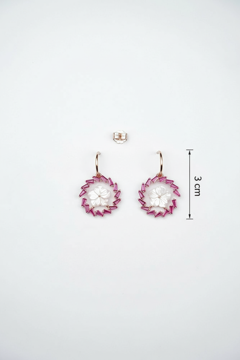 Pair of earrings with a measurement label on a white background