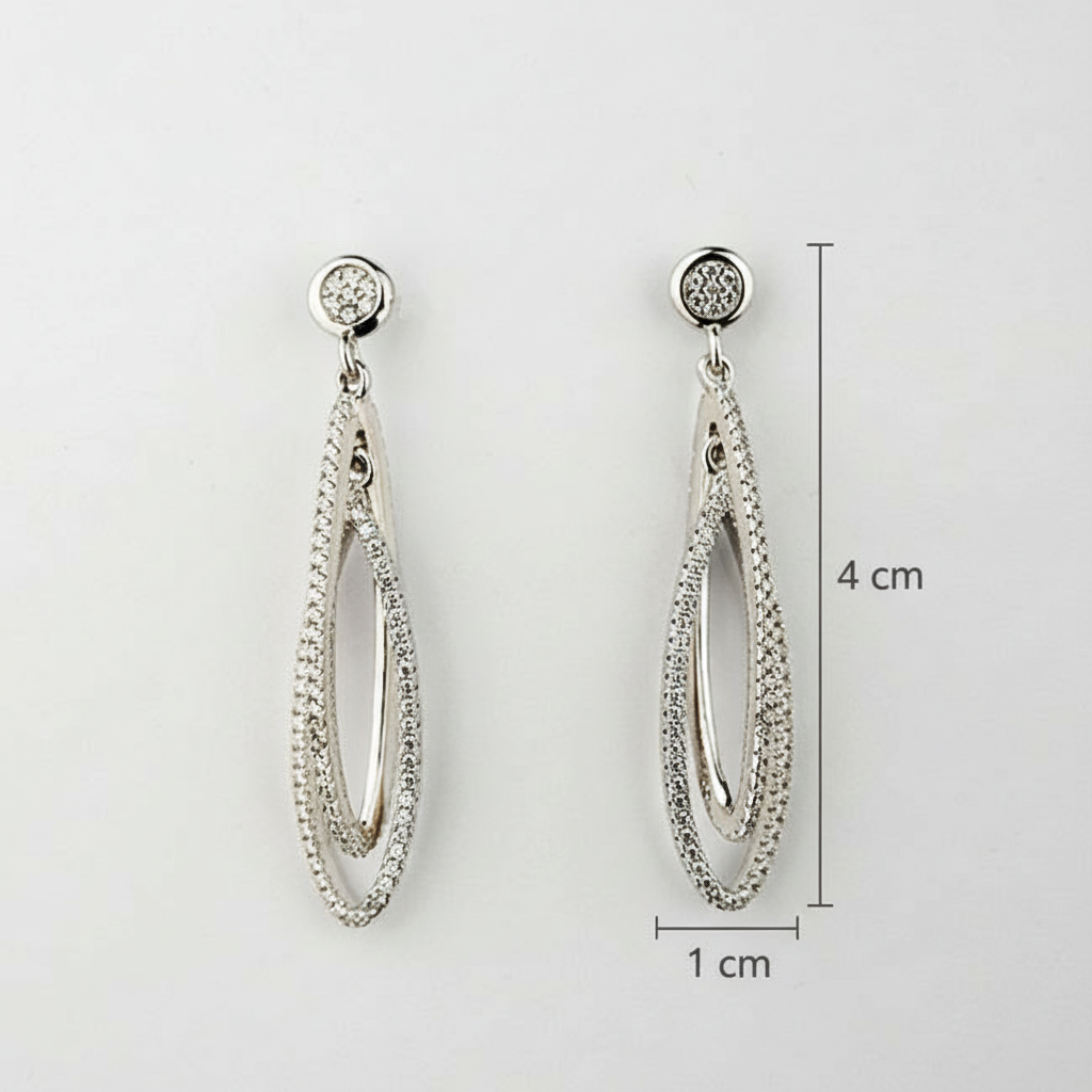 Silver earrings with measurement details on a white background
