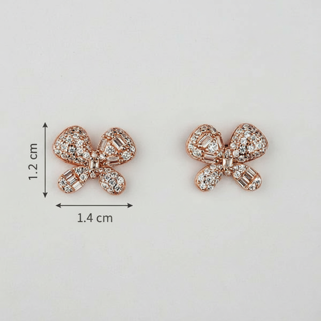 Rose gold bow-shaped earrings with AAA+ Cubic zircons on a light gray background, accompanied by measurements.