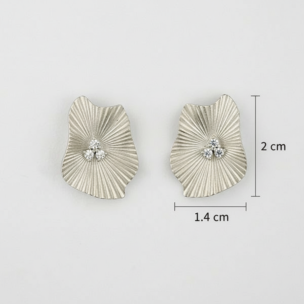 Silver earrings with textured design and CZ, shown with measurements on a light gray background.