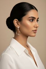 Woman wearing gold hoop earrings 