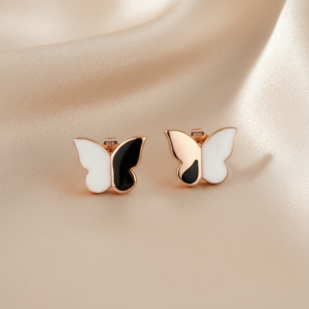 Butterfly-shaped earrings with rose gold frame 