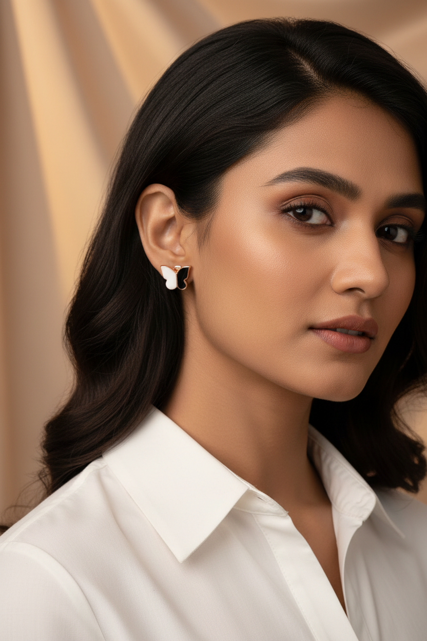 Woman wearing a white shirt with 925 Sterling Silver rosegold butterfly earrings 