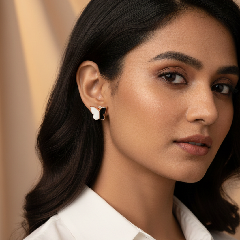 Close-up of a woman wearing  925 Sterling Silver rosegold butterfly earrings 