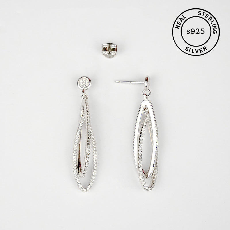 Silver earrings on a white background with 'Real Sterling S925' stamp.