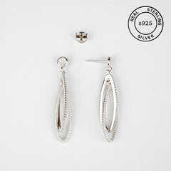 Silver earrings on a white background with 'Real Sterling S925' stamp.