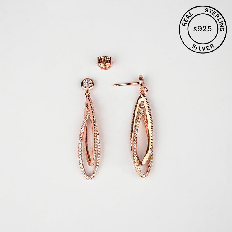Rose gold earrings with 'Real Sterling Silver 925' stamp.