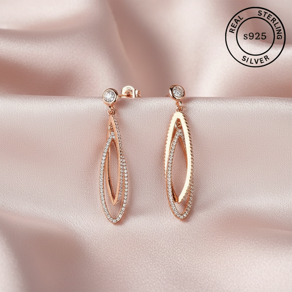 Rose gold earrings with zircon stones , featuring a 'Real Sterling Silver 925' stamp.
