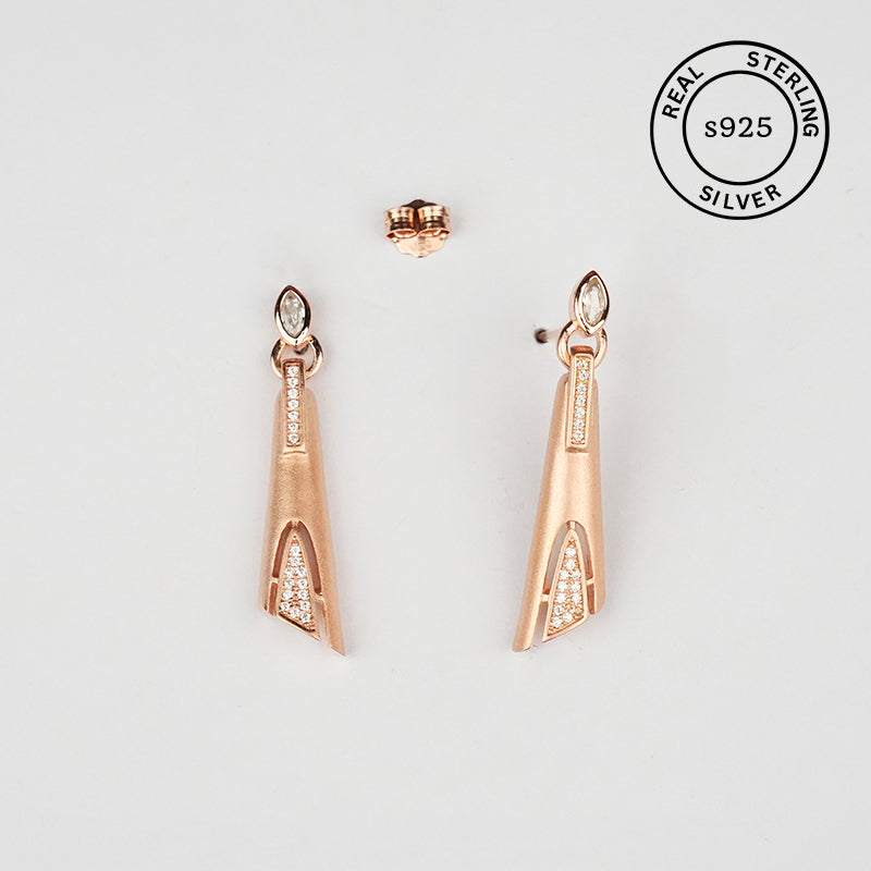 Rose gold earrings with clear stones , featuring 'Real Sterling Silver' stamp.