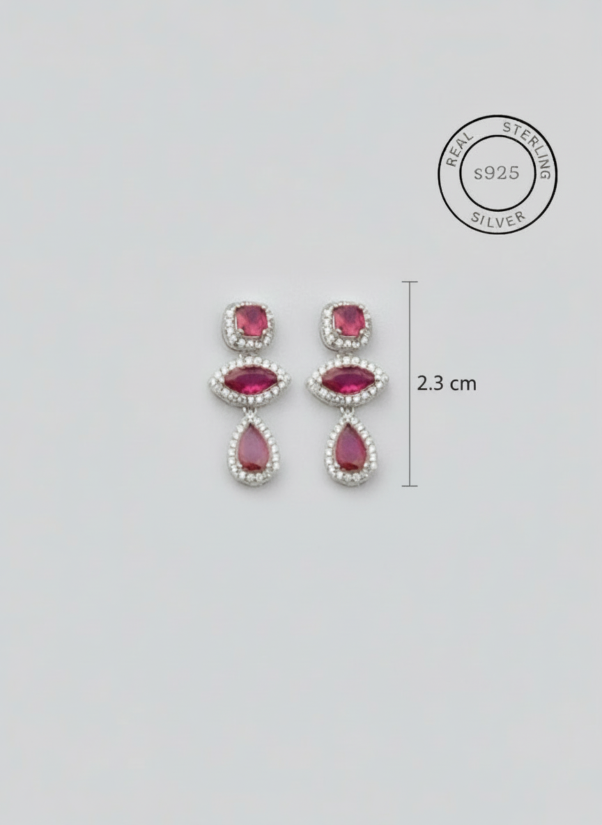 Pair of earrings with pink gemstones , featuring '925 Sterling Silver' text.