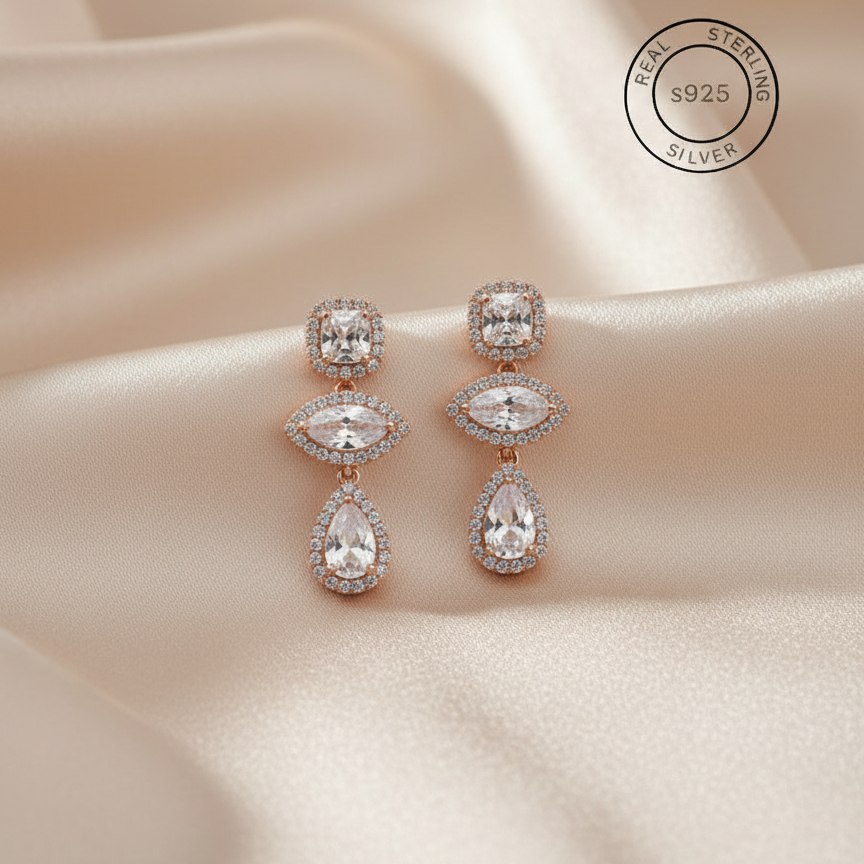 Rose gold earrings with AAA+ cubic Zirconas, featuring 'Real Sterling Silver' S925 stamp.
