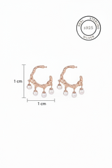 Rose gold earrings with pearls and measurement details on a white background