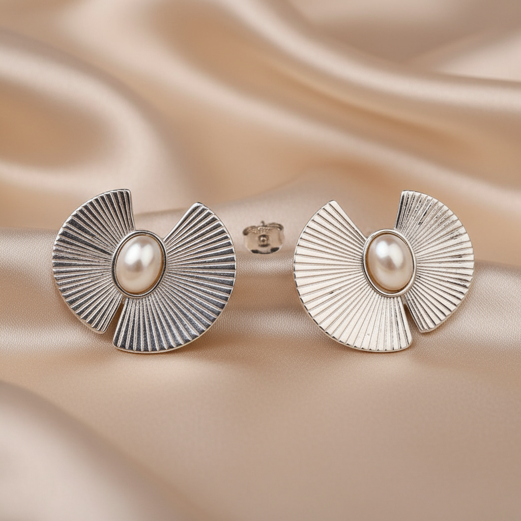 Silver Pearl Textured Earstuds
with pearl center on a beige fabric background