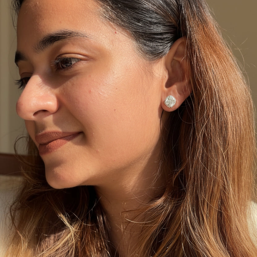Close-up of a woman wearing 925 Sterling Silver Bucket Studs