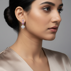 Close-up of a woman wearing Silver Rani pink Dangles